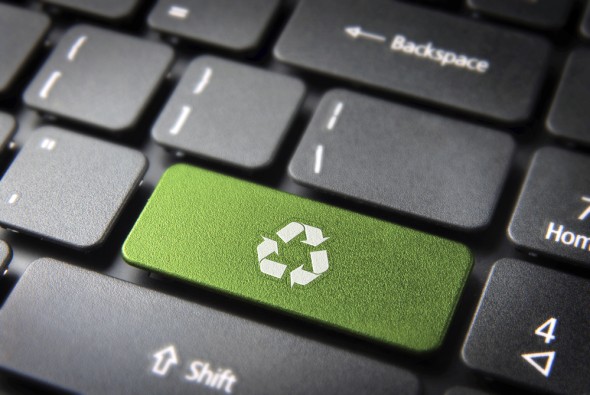 Go green key with wind turbine icon on laptop keyboard. Included clipping path, so you can easily edit it.